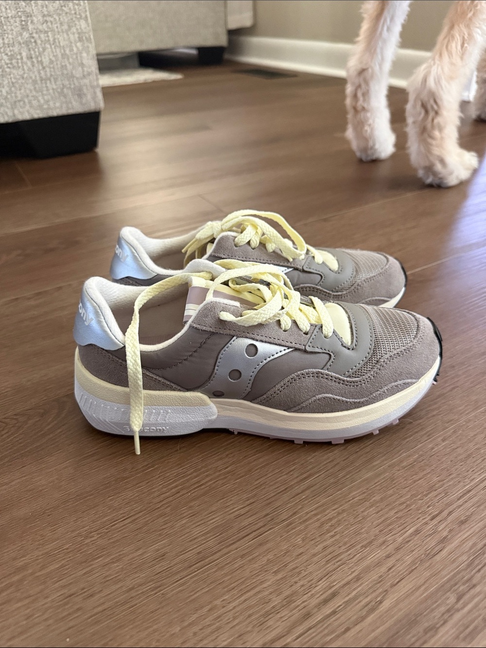 Saucony gray sneakers with pale yellow accents